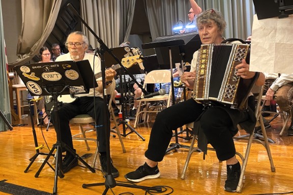 The band standing up while playing